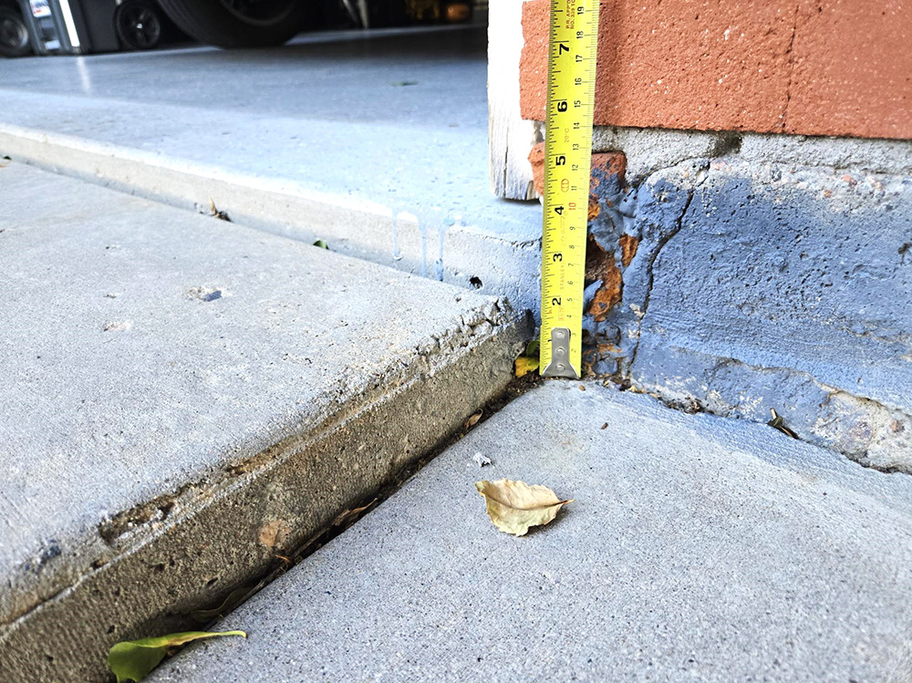 Driveway Slab concrete lifting - before