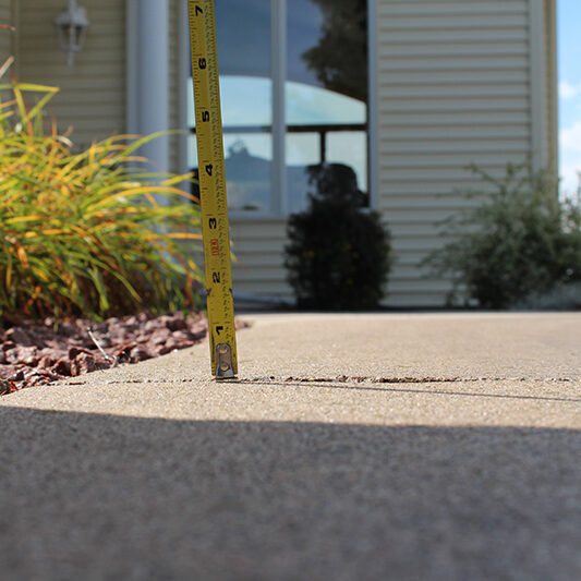 Walkway concrete lifting - before