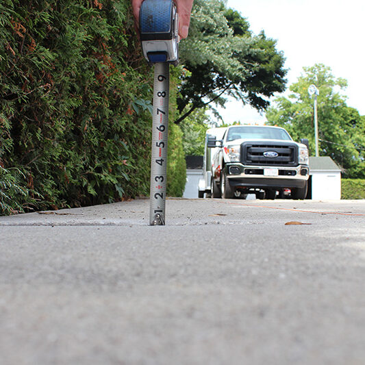 sidewalk concrete lifting project - before